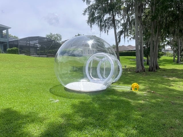 Pink and blue Bape themed outdoor castle, ball pit and bubble globe